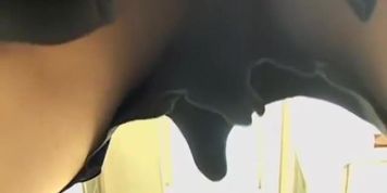 Friendly Asian gal keeps smiling while her cleavage is totally revealed