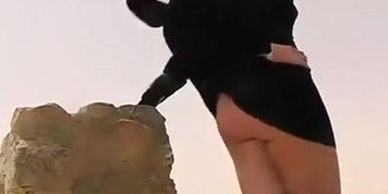 Blonde with a perfect ass having problems with the wind