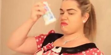 Saskia Blasts undresses and coats her tits & butt in custard