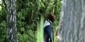 Woman looking for place to pee outdoors