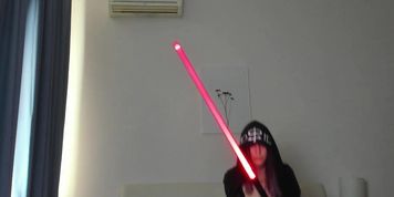 sexy as screw chick playing with a lightsaber