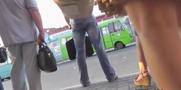 G-string upskirt footage of a redhead on a bus stop