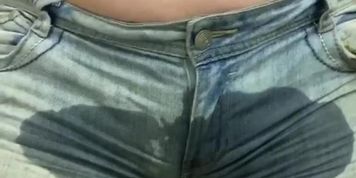 young chubby girl with big boobs pisses in her shorts before showing off her ass and pussy