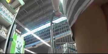 Sexy blonde pulling her shopping cart