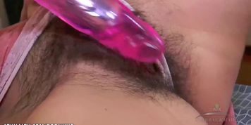 Evelina Darling fucks her hairy pussy with toy