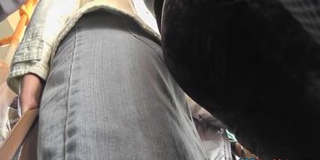 Slim girl shows off thong in candid upskirts video