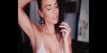 Gina Carla styling her hair