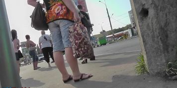 Blonde MILF caught on the upskirt camera in the bus