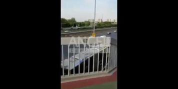 Chinese naked walking on bridge