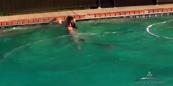 Sexy brunette with hairy pussy swimming in pool