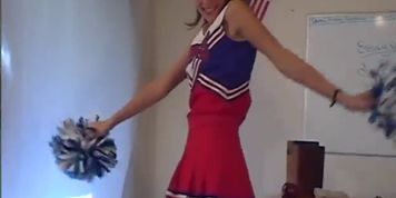 Brunette Cheerleader Showing Off Her Assets