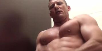 muscle daddy jacks out a load in the bathroom at work