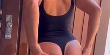 nerokoi flashing in a one piece swimsuit