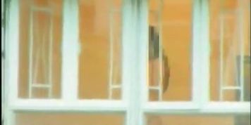 A horny voyeur loves filming hot girls thru the window.