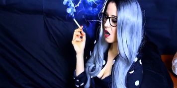Sexy young girl blowing super hot smoke