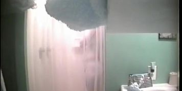 An alluring bimbo caught on a spy cam in the shower