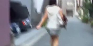 Adoring vivacious chick walking in the street while meeting some sharking guy