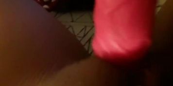brunette plays with the dildo in her pussy