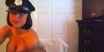 Busty police woman stripteasing and showing her big fleshy melons