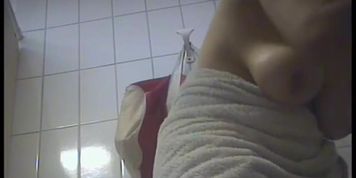 Female amateur got nude tits spied after shower on spy cam