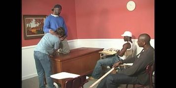 A black teacher and two black students sharing a white guy