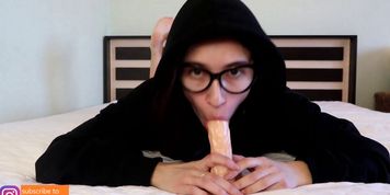 TEEN IN A BLACK HOODIE PLAYS WITH DILDO