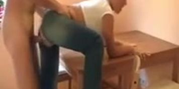 Whore in ripped jeans drilled on the kitchen table