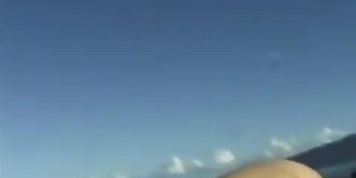 Couple play on Hawaii beach
