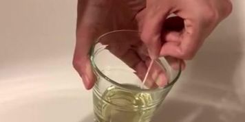 Pregnant peeing and taking a pregnancy test at 9 weeks