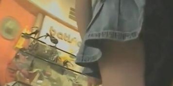 Upskirt porno of a tall brunette with a great ass in a short-skirt