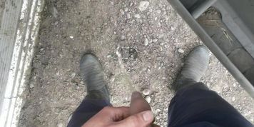 Lad taking a piss in gumboots pov
