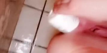Girl stretches ass with big objects