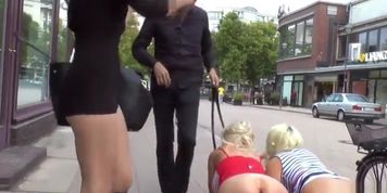 Busty bombshells made to crawl in public