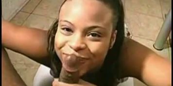 Ebony on her knees sucking and balls stroking - video 1