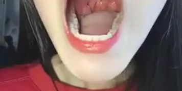 Attractive Chinese girl wants you to smell her breath