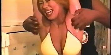 Asian woman upperbody tickle