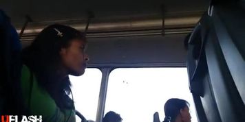 next to girl in bus