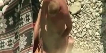 Spying horny couple on the beach