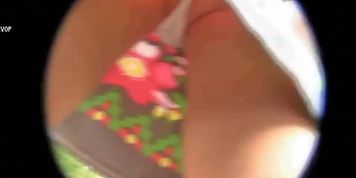 A fit redhead with a phenomenal ass filmed outside in an upskirt