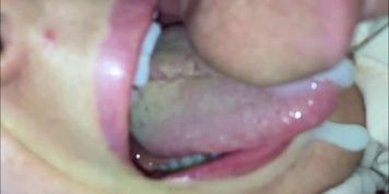 Ejaculating in her mouth - closeup