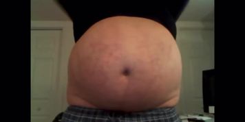 Overstuffed belly in spandex shirt 