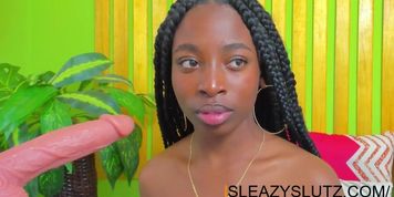 Sexy ebony warming up her mouth and throat