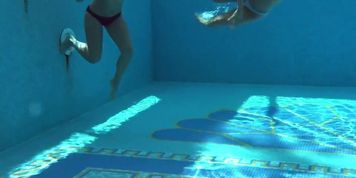 Jessica and Lindsay swim naked in the pool