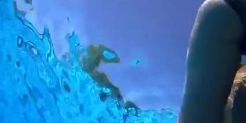 Attractive girl gets groped by her friend under the water