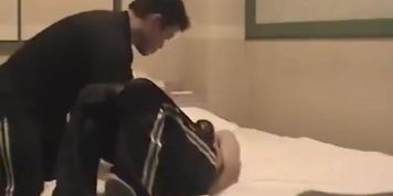 Master takes punches and knees to the slave gut over and over again.