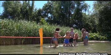 Interracial Nudists Playing Games In River Voyeur