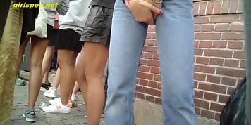 Voyeur Girl pissing in a corner in public
