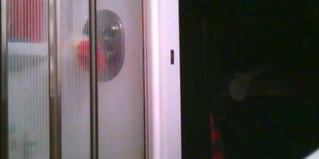 Unaware wife getting undressed