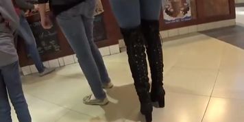 Perfect girl in tight jeans and high boots