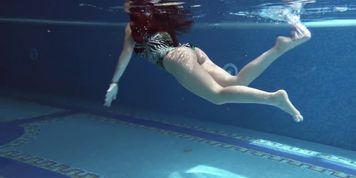Diana Rius with hot boobs touches her body underwater